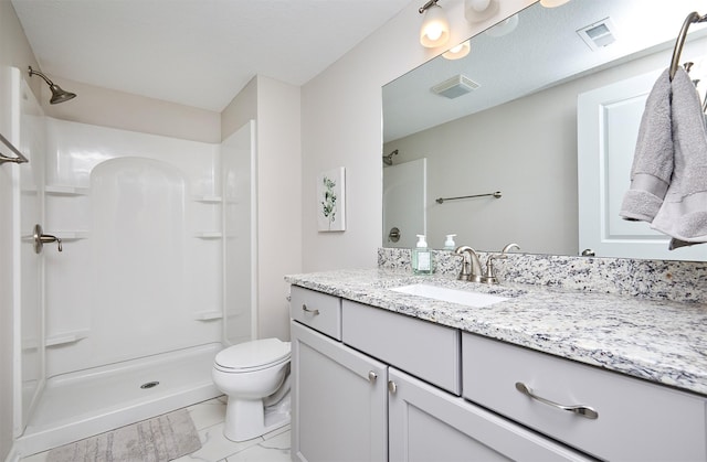 full bathroom featuring visible vents, toilet, walk in shower, and vanity