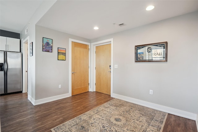 entrance foyer featuring dark hardwood / wood-style flooring