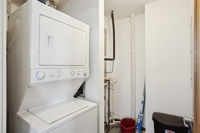 laundry area featuring stacked washer / dryer