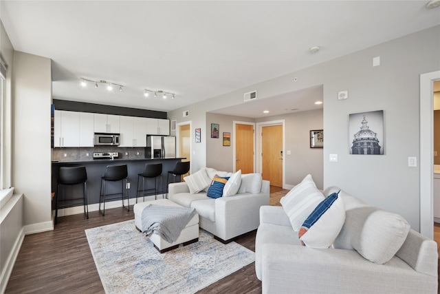 living room featuring dark hardwood / wood-style flooring