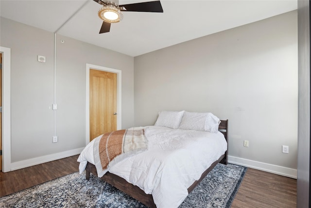 bedroom featuring ceiling fan and dark hardwood / wood-style floors