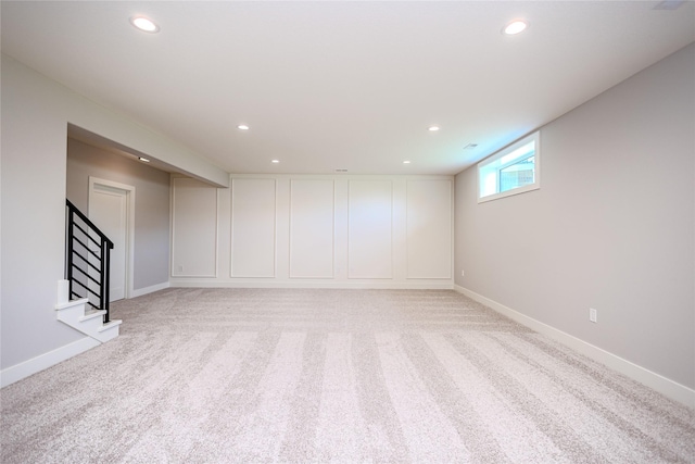 16217 Walnut Meadows Ct, Urbandale, IA 50323 - basement featuring light colored carpet, recessed lighting, baseboards, and stairs