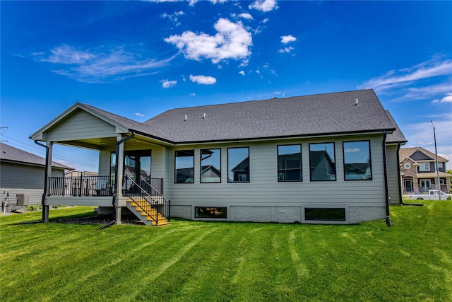 16217 Walnut Meadows Ct, Urbandale, IA 50323 - back of house featuring a lawn, a shingled roof, and stairway