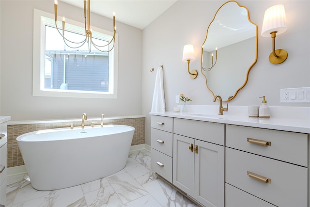 16217 Walnut Meadows Ct, Urbandale, IA 50323 - bathroom featuring vanity, a freestanding bath, marble finish floors, and a wainscoted wall