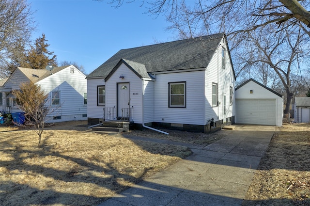 view of front facade featuring an outbuilding and a garage