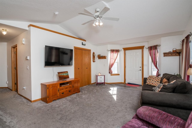 living room with vaulted ceiling, carpet flooring, and ceiling fan