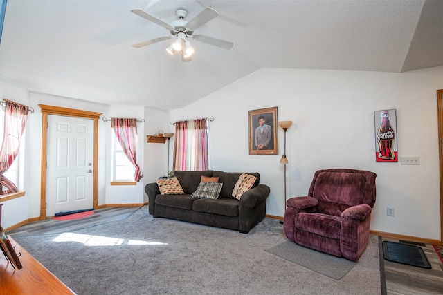 carpeted living room featuring vaulted ceiling and ceiling fan