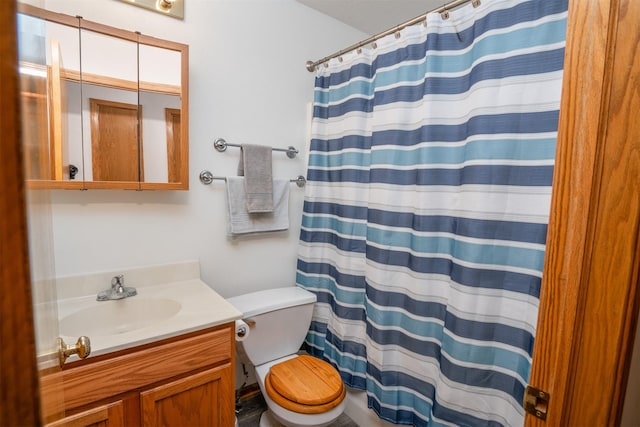 bathroom featuring vanity and toilet