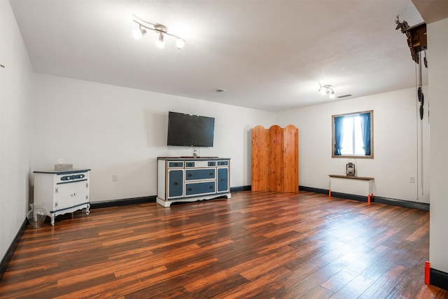 living room featuring dark wood-type flooring