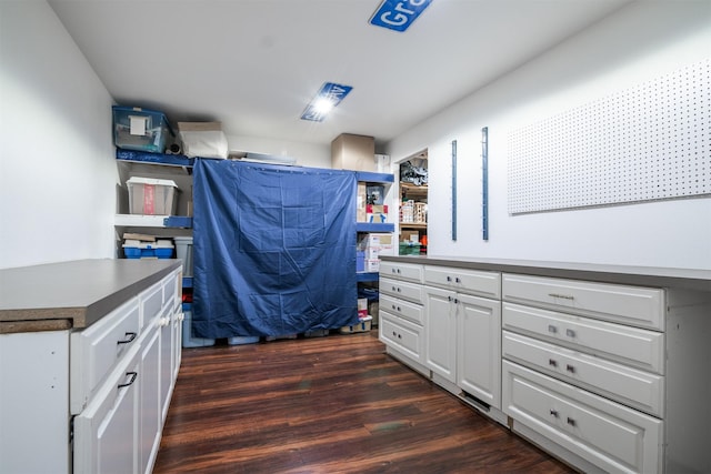 office space with dark wood-type flooring