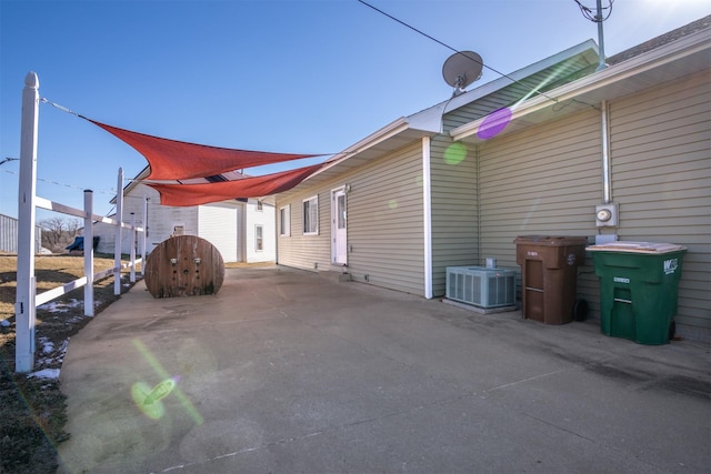 view of home's exterior featuring cooling unit and a patio