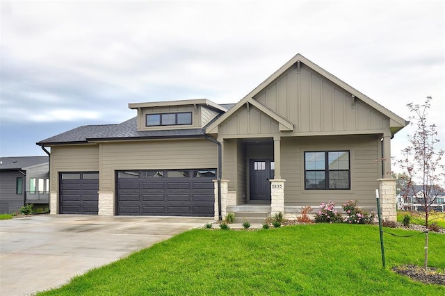 view of front of home featuring a garage and a front yard