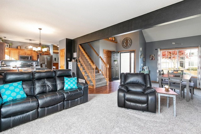 living room with sink, carpet, and vaulted ceiling with beams