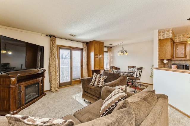 living room featuring light carpet and a textured ceiling