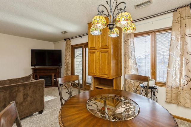 dining room with a wealth of natural light and a textured ceiling