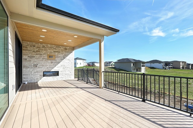 wooden deck featuring a residential view