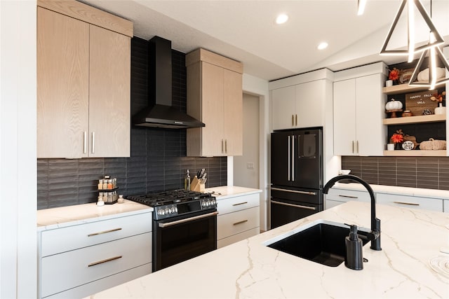 kitchen with open shelves, tasteful backsplash, a sink, wall chimney range hood, and black appliances