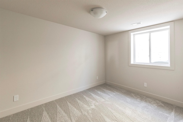 empty room with carpet flooring