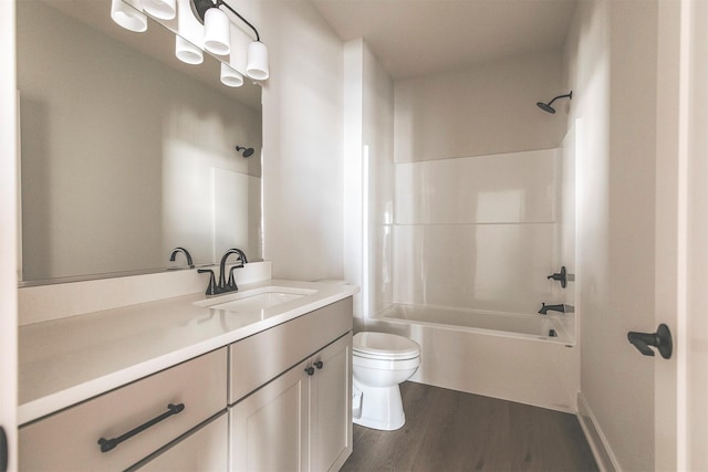 full bathroom with toilet, vanity, wood-type flooring, and bathtub / shower combination