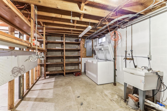 basement with washer / clothes dryer and electric panel