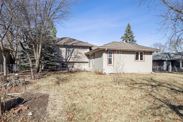 view of side of home featuring a yard