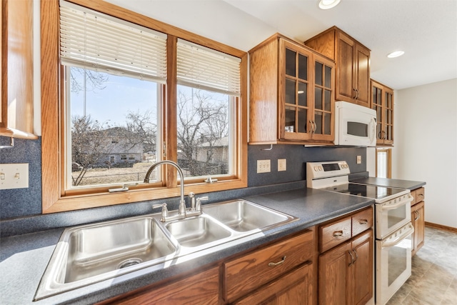 kitchen featuring sink and white appliances