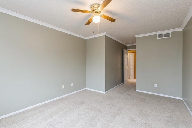 carpeted spare room with ornamental molding and ceiling fan