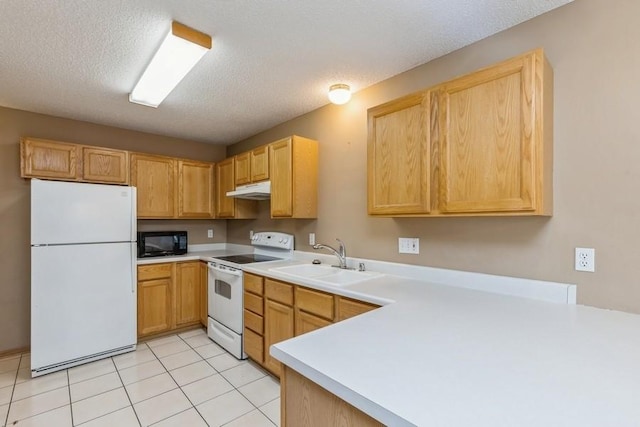 kitchen with sink, white appliances, light tile patterned floors, a textured ceiling, and light brown cabinets