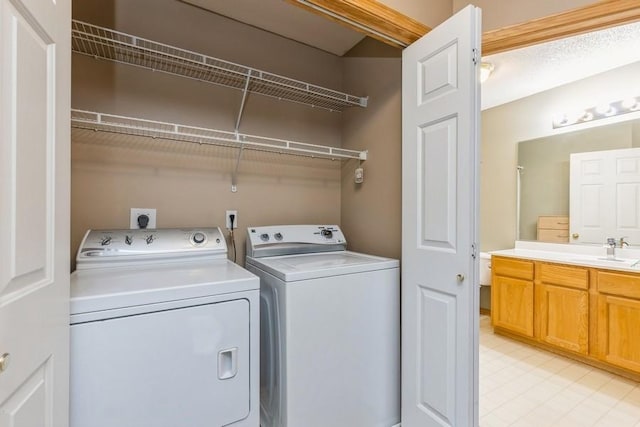 laundry room featuring sink and independent washer and dryer