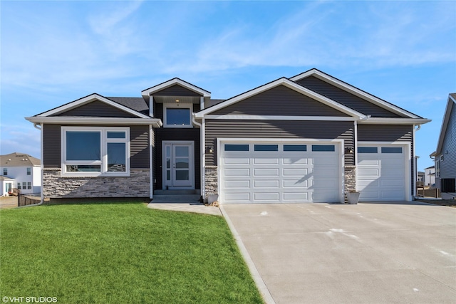 1210 NW Pine Bluff Cir, Waukee, IA 50263 - view of front of property with concrete driveway, a garage, a front lawn, and stone siding