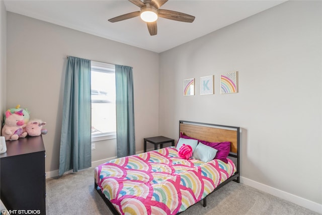 bedroom featuring light carpet, multiple windows, and ceiling fan