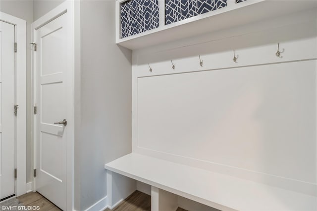 mudroom with wood-type flooring