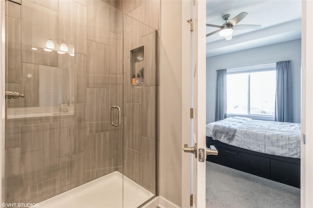 bathroom with an enclosed shower and ceiling fan