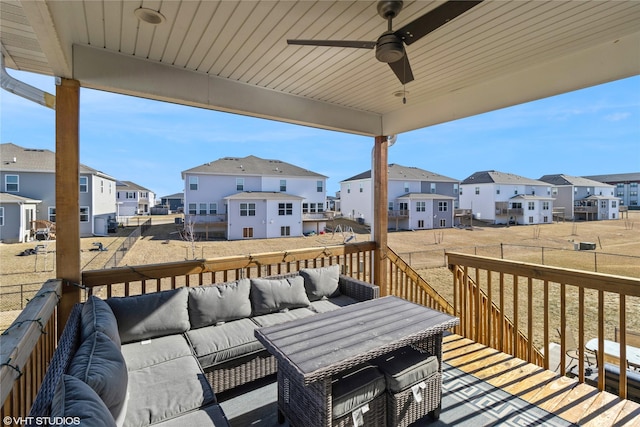 deck featuring ceiling fan and an outdoor living space