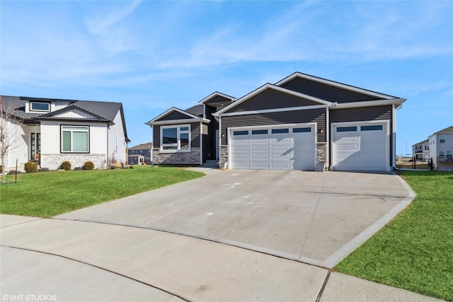 view of front of property with a garage and a front lawn