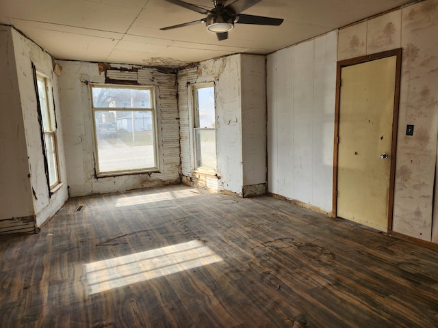 interior space with dark hardwood / wood-style floors and ceiling fan