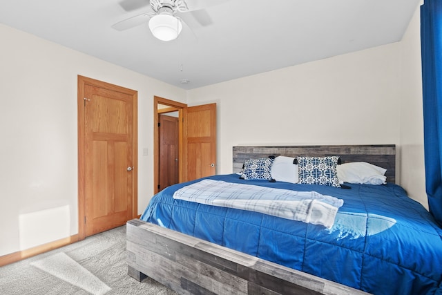 carpeted bedroom featuring ceiling fan