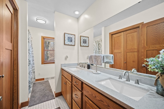 bathroom with vanity and tile patterned floors