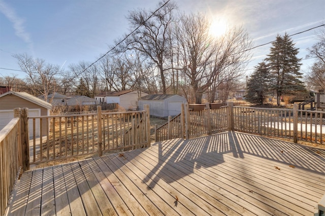 wooden deck featuring a storage unit