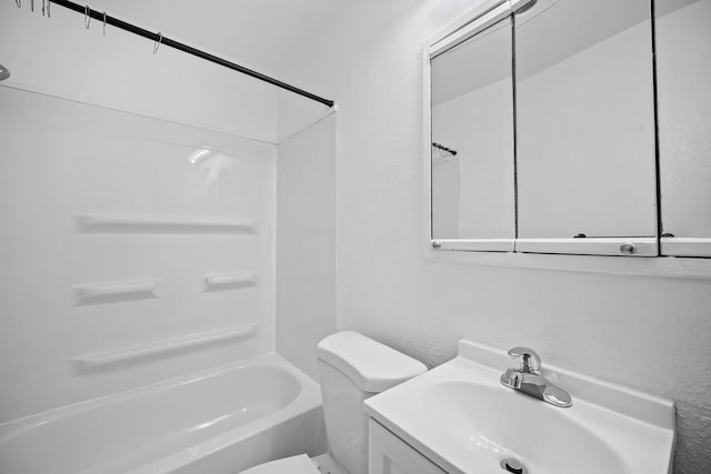 full bathroom with vanity, tub / shower combination, and toilet