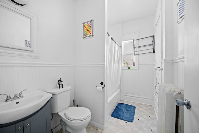 full bathroom with shower / bath combination with curtain, vanity, toilet, and radiator