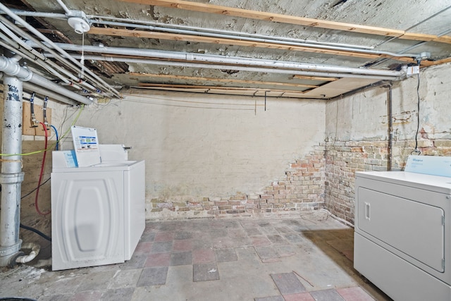 basement with washer and clothes dryer