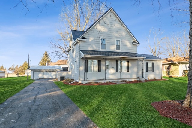 view of front facade with a garage, an outdoor structure, a front lawn, and covered porch