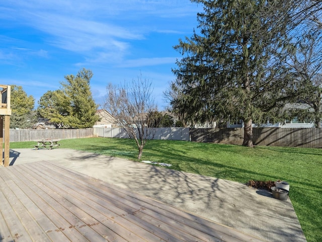 deck featuring a lawn and a patio