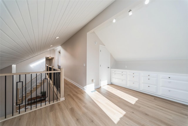 bonus room with vaulted ceiling, light hardwood / wood-style floors, and wooden ceiling