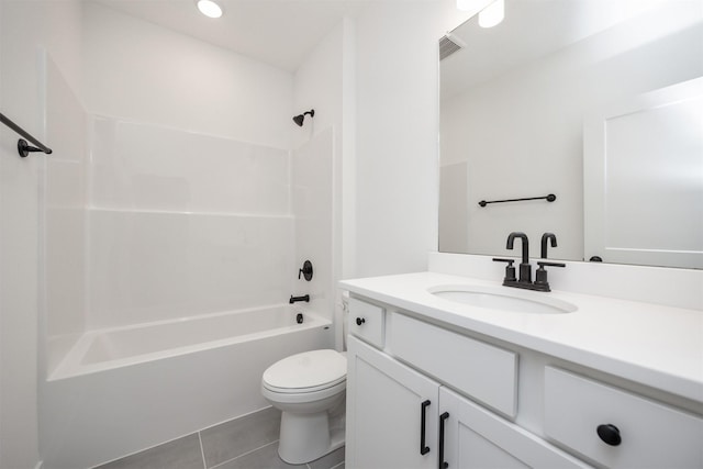 full bath featuring visible vents, toilet, washtub / shower combination, vanity, and tile patterned flooring