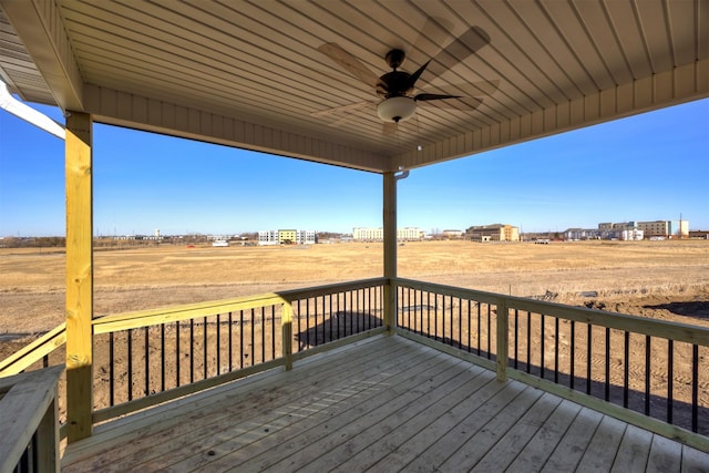 wooden terrace with ceiling fan and a rural view