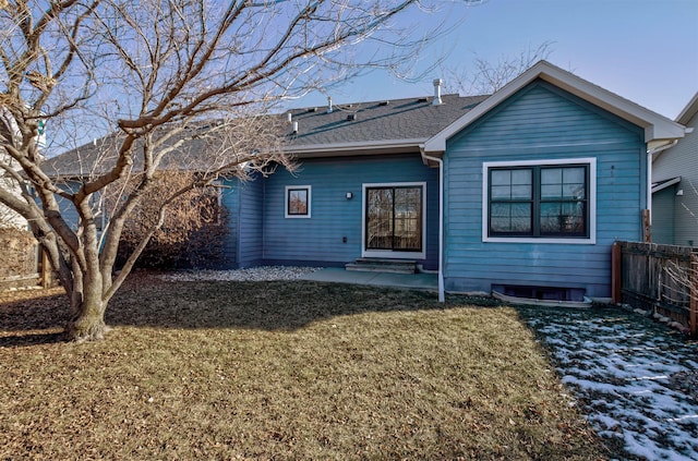 back of property featuring a lawn and a patio