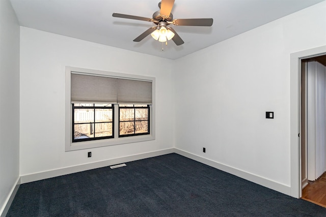 carpeted empty room with ceiling fan