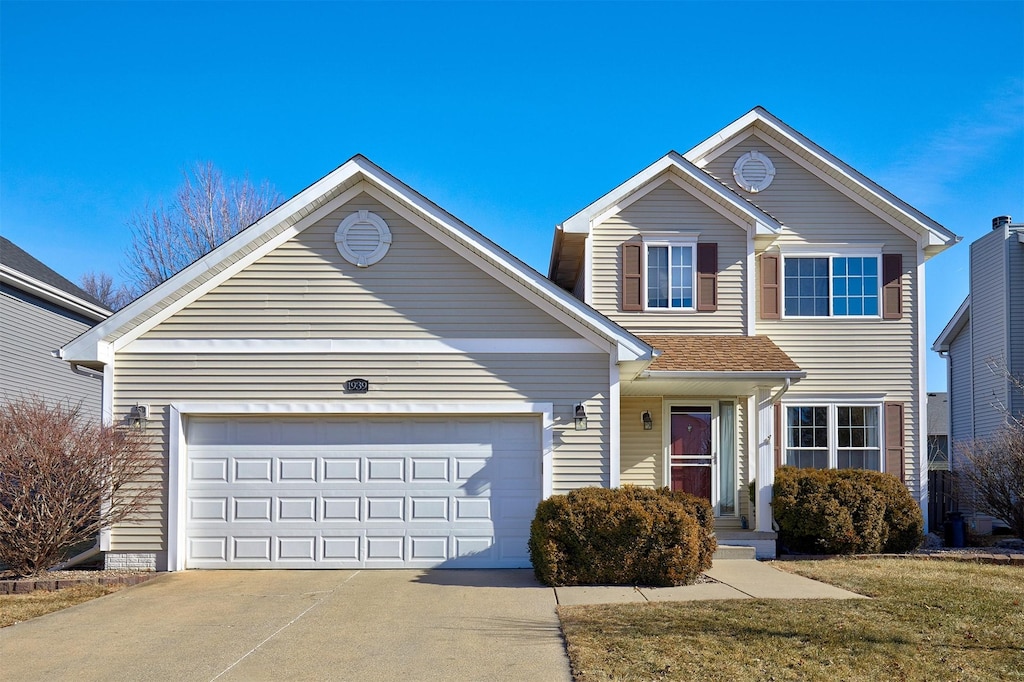 front of property with a garage